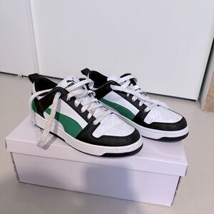 Puma green, black, and white sneakers